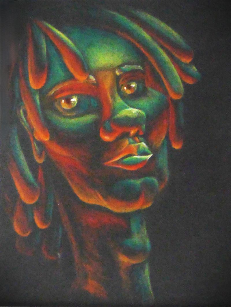 Portrait of a young man with dreadlocks in shades of green and orange.